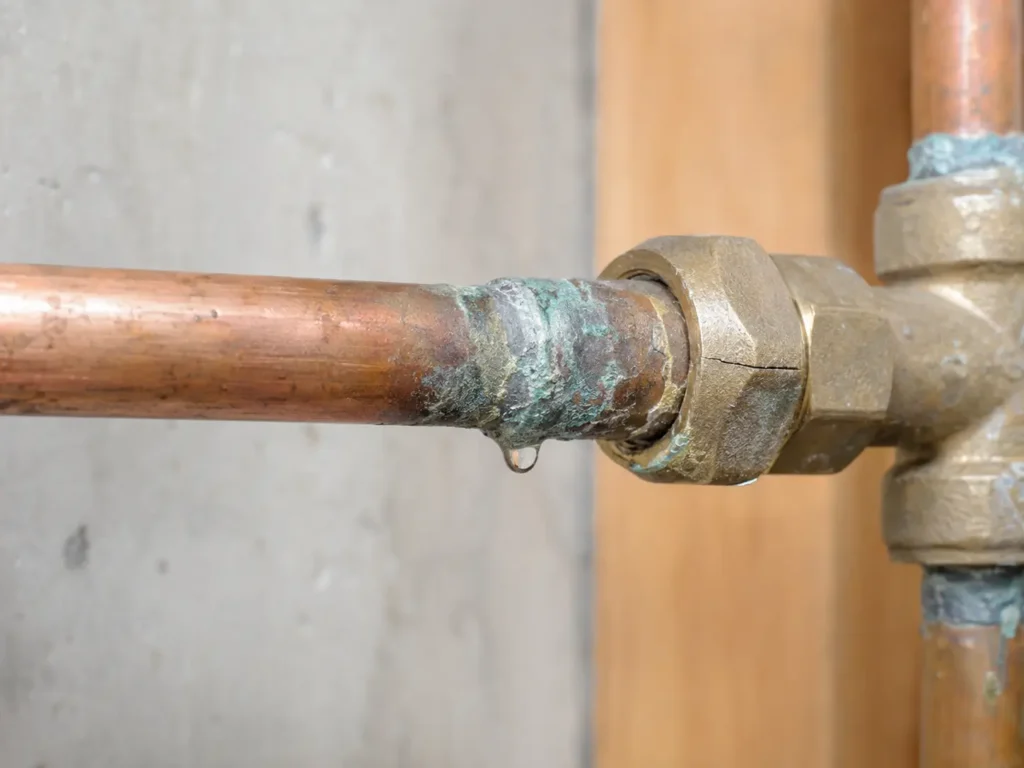 Corroded and leaking water pipe connection